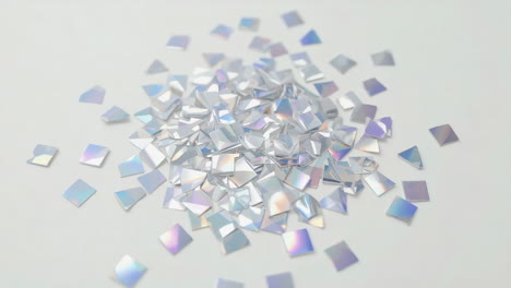 falling iridescent holographic squares on white