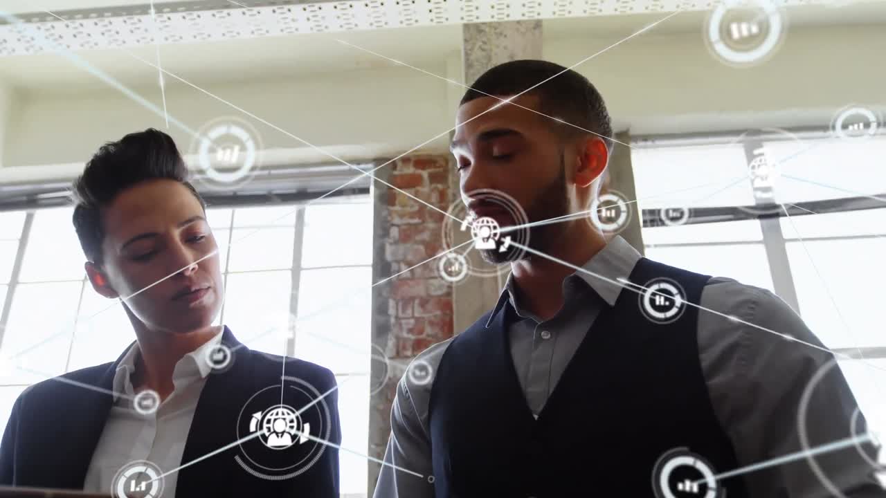 Animation of network of connections with icons over diverse business people in office
