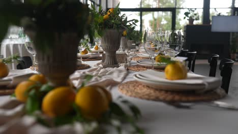 elegant table setting with lemons and floral arrangements