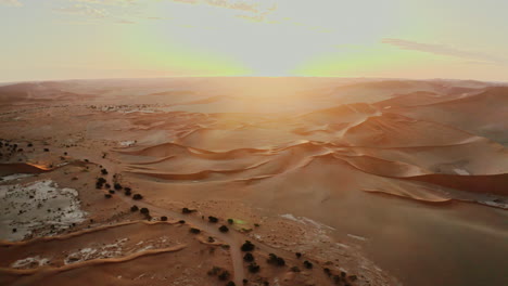 sunrise over the namib desert dunes