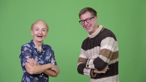 Happy grandmother and grandson giving high-five together