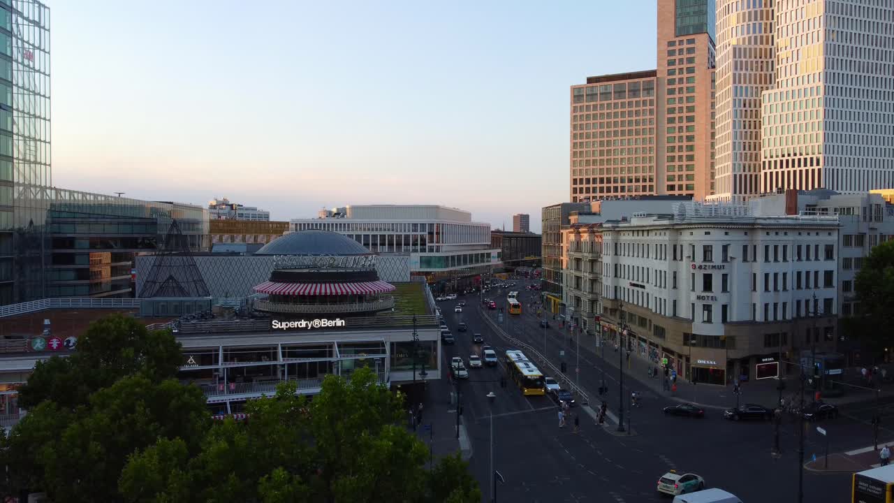 the BARN at Café Kranzler Is a well-known film setBeautiful aerial view flight static tripod droneof Kurfürstendamm Berlin germany at summer sunset July 2022. Marnitz 4k Cinematic from above