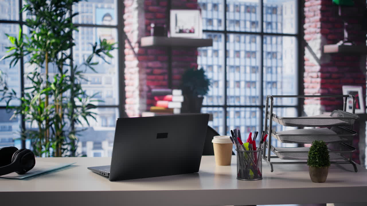 Modern Office Workplace with Laptop and City View