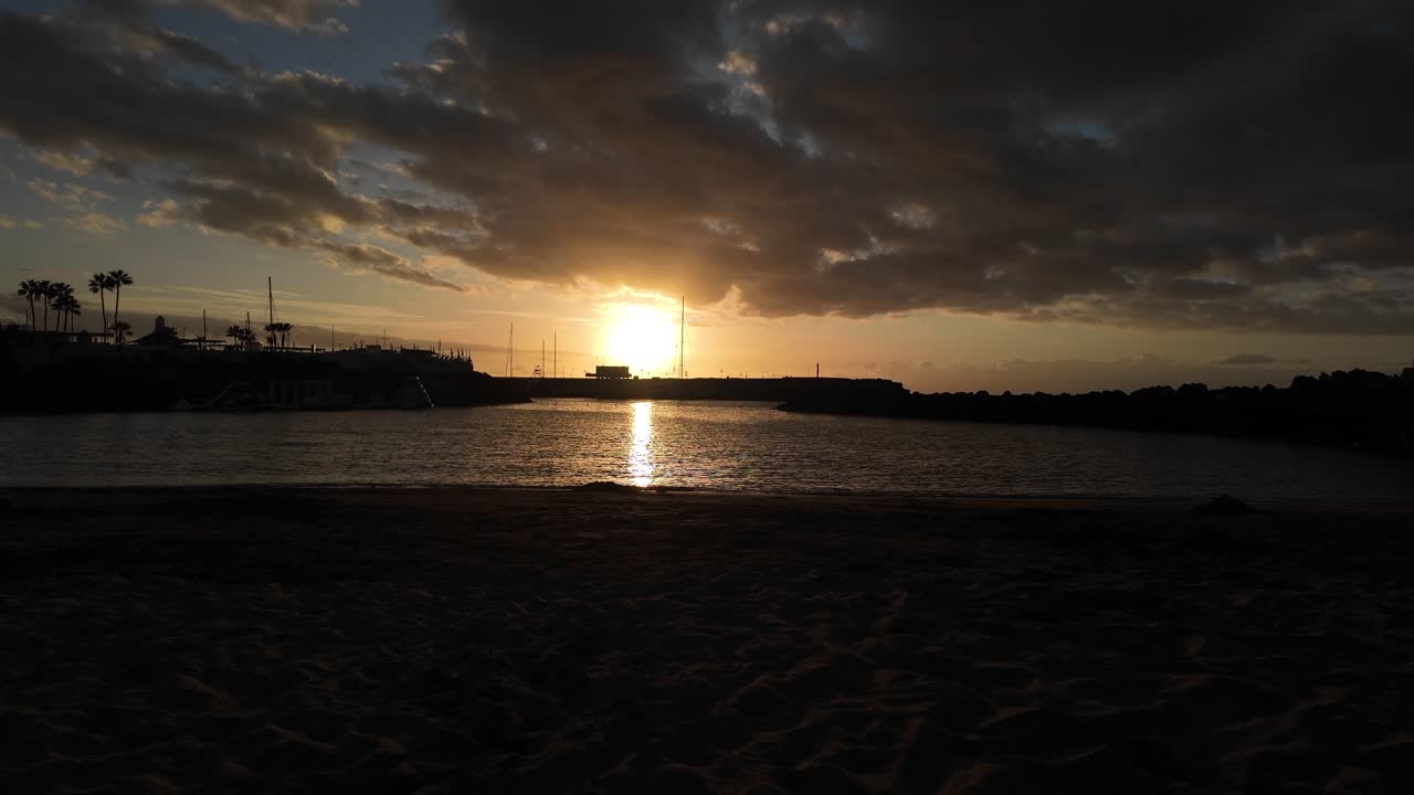 Sunset sun over ocean in Tenerife Canary Island Los Cristianos south view from beach