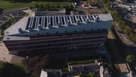lexicon, dún laoghaire, county dublin, ireland, september 2024. drone orbits clockwise while ascending above the iconic library and cultural heritage center with the east pier in the background.