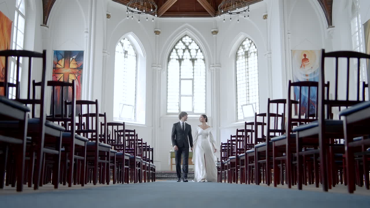 Couple Walking Down the Aisle in Church