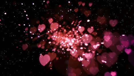 Animation-of-glowing-pink-hearts-on-black