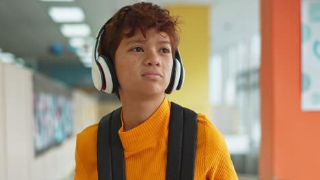boy listening to music with headphones