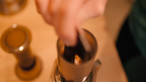 stirring coffee slow motion in areopress