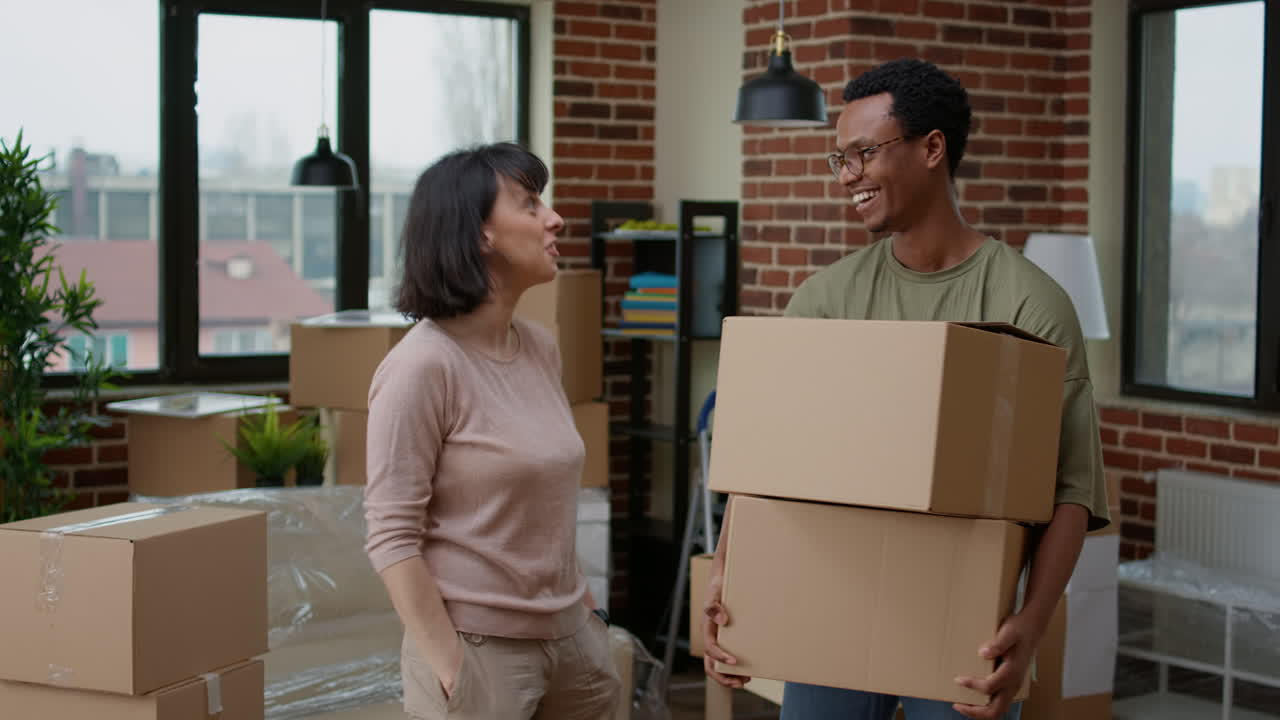 Diverse couple celebrating first home purchase to move in together