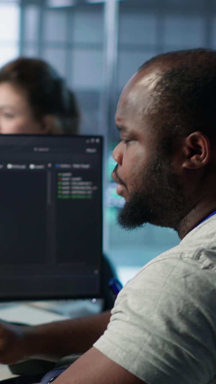African American Programmer Working on Computer in Modern Office