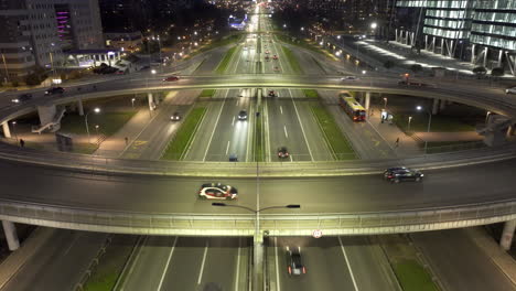 night view of a busy city highway interchange with traffic