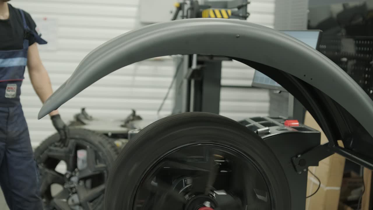 Car wheel balancing in auto repair shop