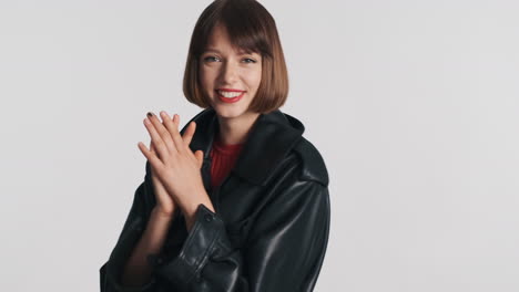 Cheerful-woman-clapping-in-studio