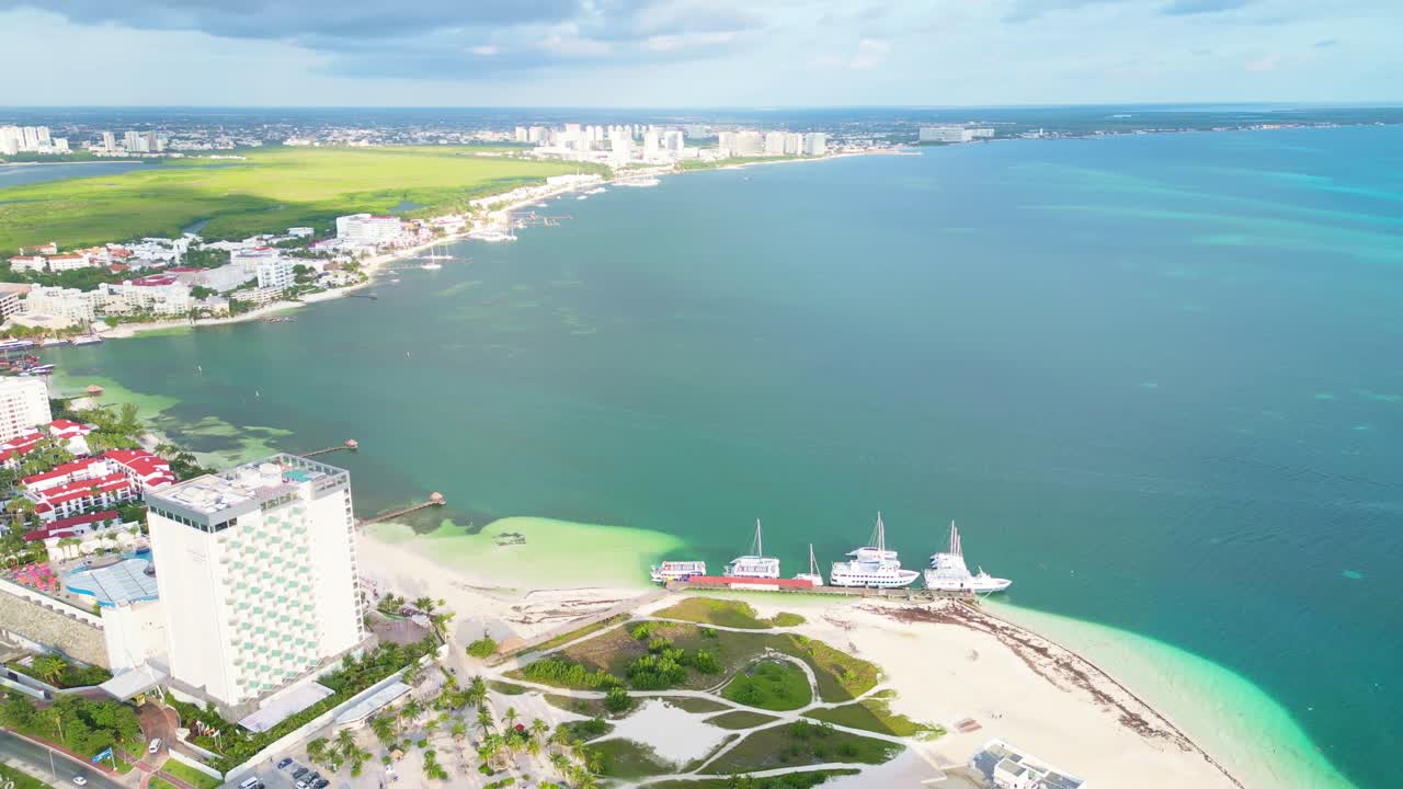 Cancun’s hotel zone, playa langosta, with turquoise waters and boats, aerial view