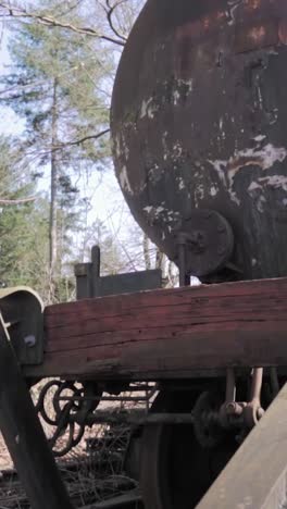 rusty abandoned tank car in the forest