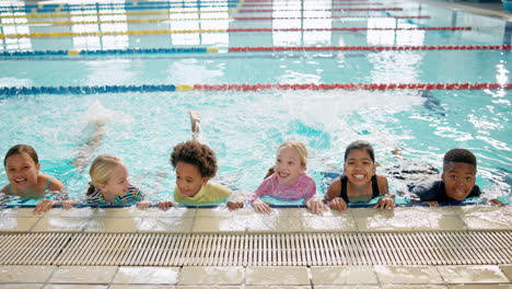 children enjoying swimming in a pool