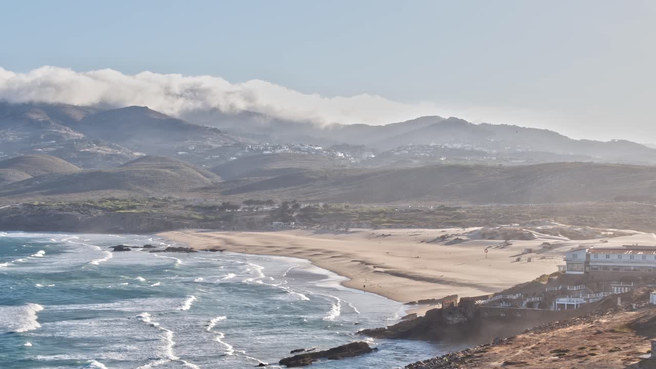 Coastal view of beaches and mountains in Portugal during the day
