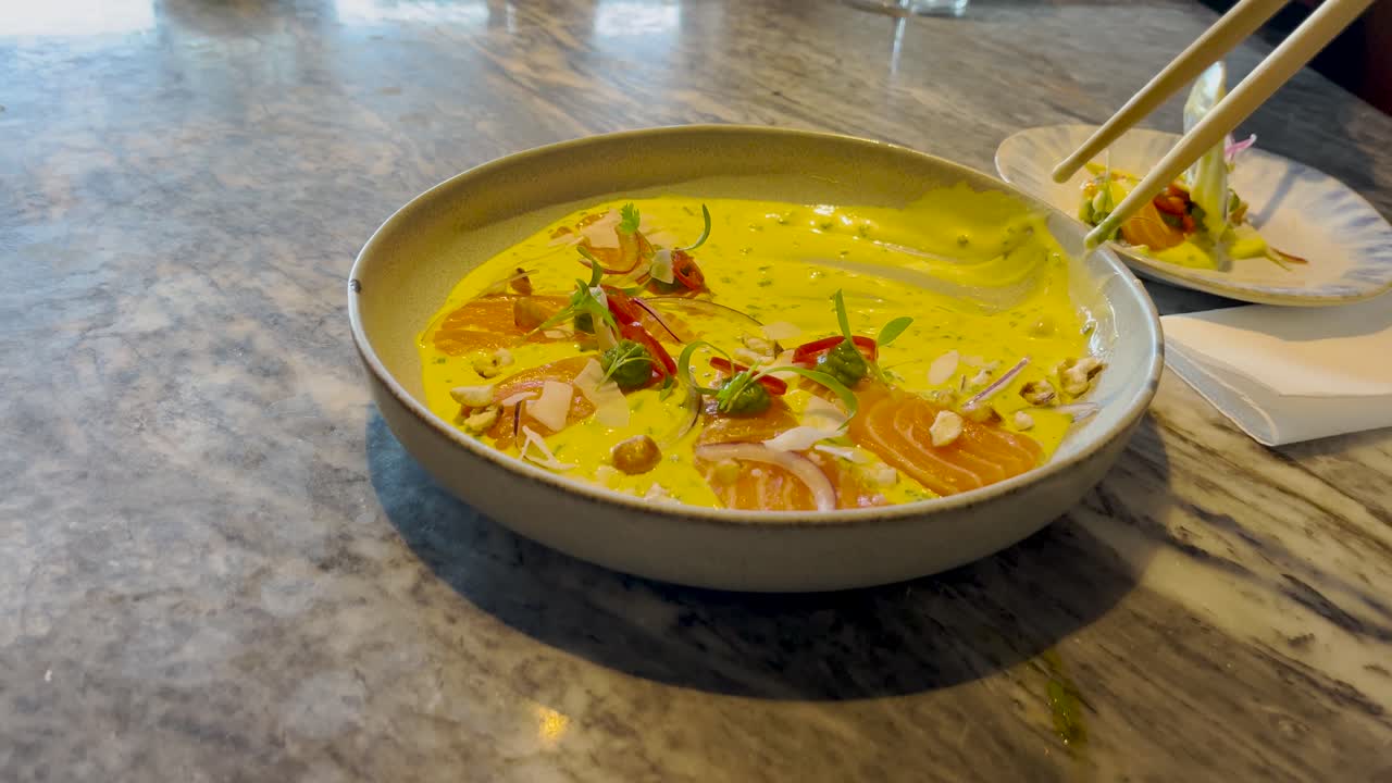 Asian inspired fusion cuisine restaurant dish salmon fish yellow curry cream sauce