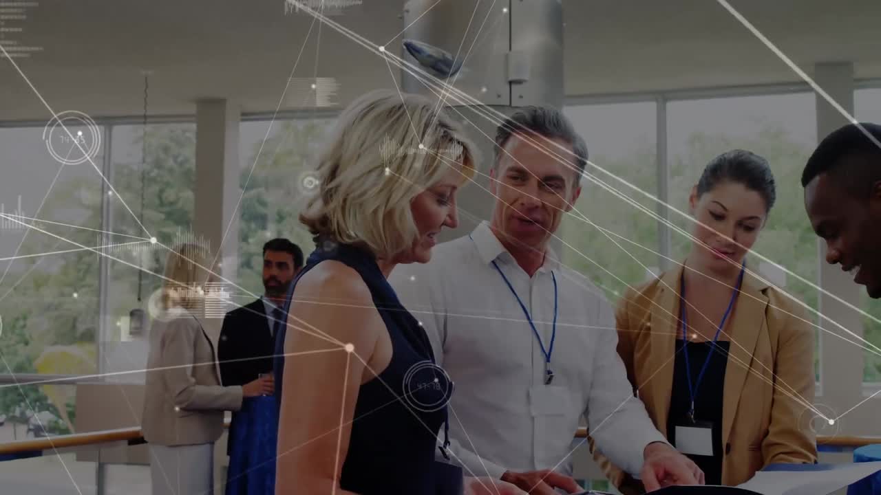 Animation of network of connections over group of diverse businesspeople discussing at office