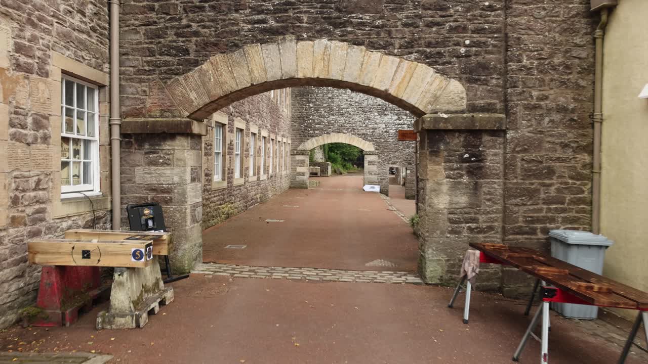 Slow pull-out shot of the antique New Lanark buildings in Scotland