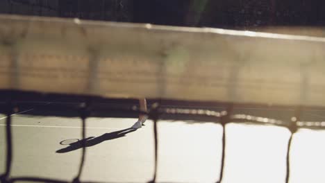 Woman-playing-tennis-on-a-sunny-day