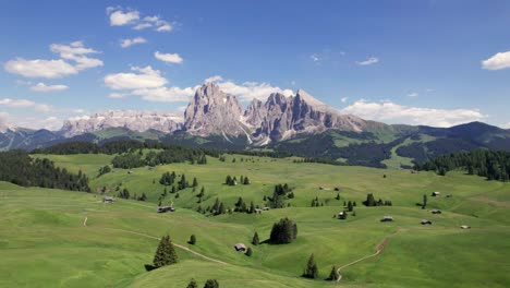 aerial view of seiser alm dolomites mountain plateau with huts in summer, italy