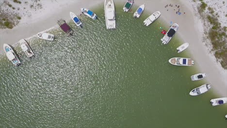 Drone-shot-of-boats-anchored-on-an-island-in-Florida