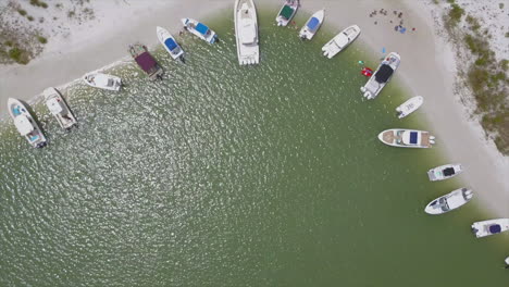 drone shot of boats anchored on an island in florida