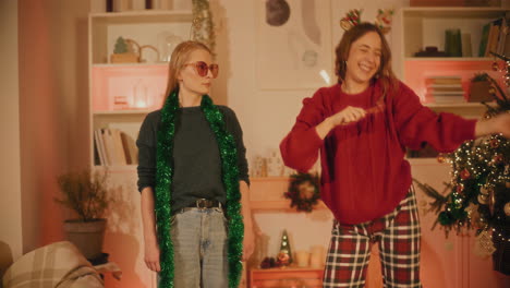 woman dancing by friend standing in living room