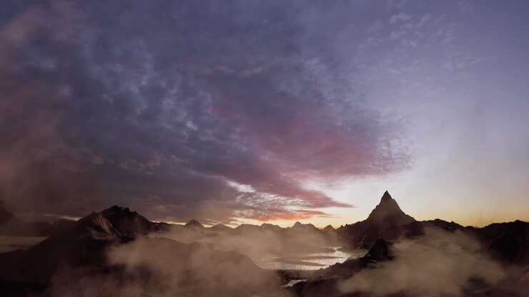 Sun Glow And Lust Sunlight In Evening Hazy Sky. Mountain Panoramic Peaceful View. Climate, Environment And Travel Concept Scene