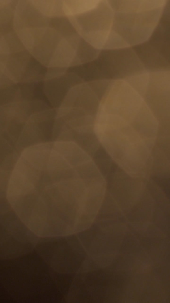 Sfondo astratto di luci bokeh dorate scintillanti