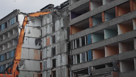 destruction excavator house demolishing. demolition building by machine.