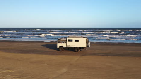 aerial tracking family riding beach expedition truck rv overlander atlantic ocean brazil