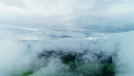 white thick clouds over rural landscape - drone shot