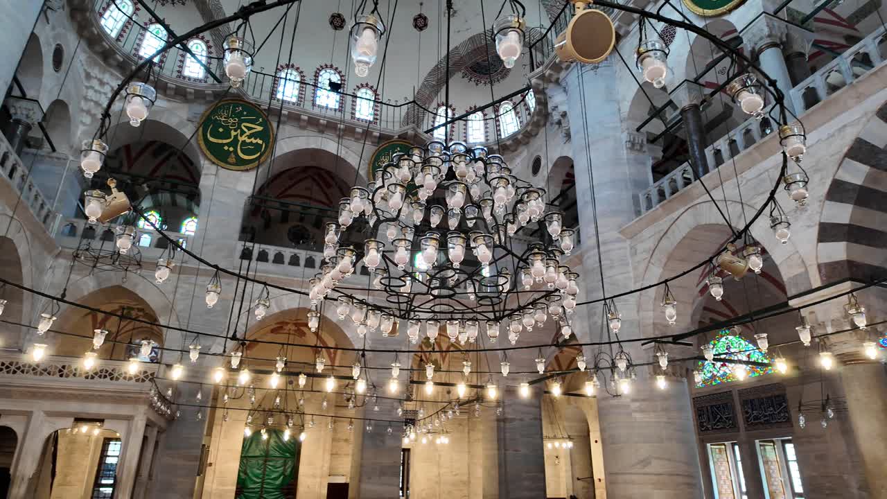 Interior of a Mosque with a Large Chandelier