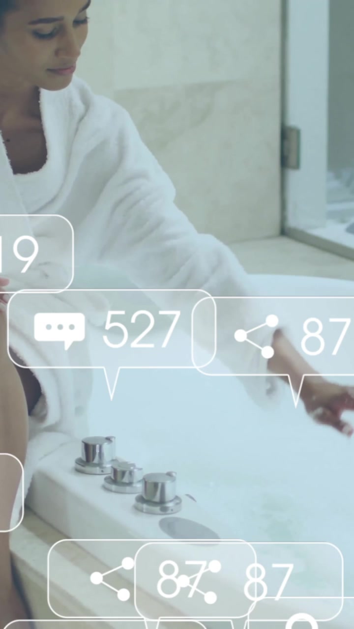 Animation of social media notifications over woman in robe running bath