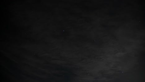 time lapse of clouds rolling by to reveal a starry night, wide 4k