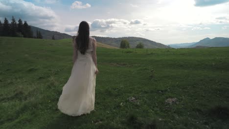 woman in a dress on the mountain