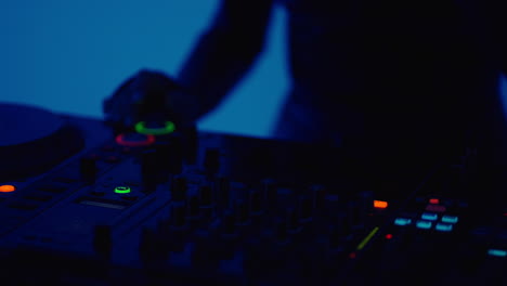 a dj performing at a nightclub