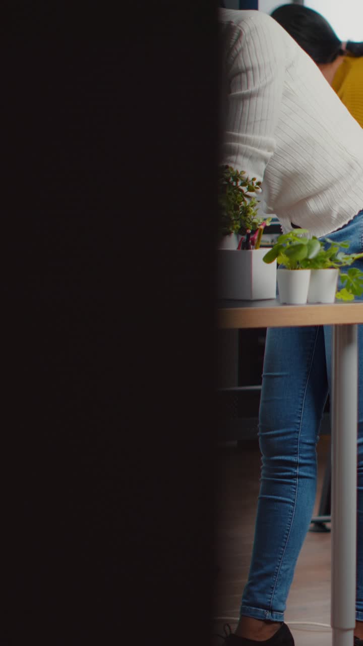 Vertical video Professional heavy industry team of engineers working on computer