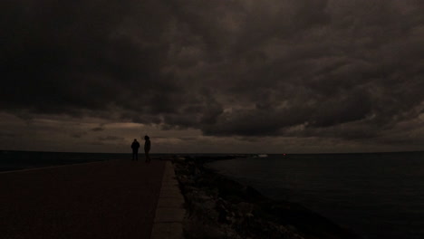 4k time lapse of dark clouds by the coast at marbella, spain