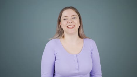 young woman winking at camera.