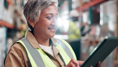 warehouse worker using tablet for inventory management