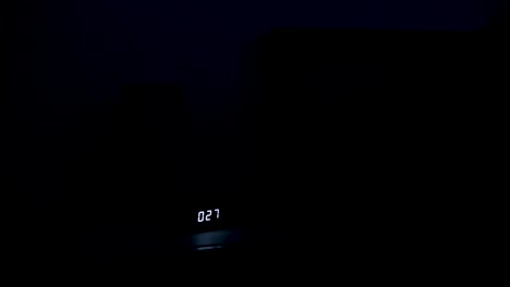 Young-male-goes-to-bed-late-at-night,-turns-off-nightstand-lamp