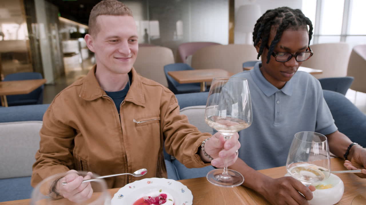 Friends Enjoying a Meal in a Modern Restaurant