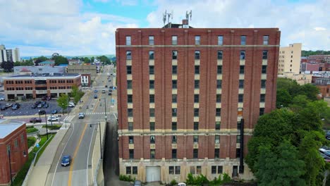 Aerial-drone-footage-of-downtown-Jamestown,-New-York,-during-summer-time-on-a-sunny-day