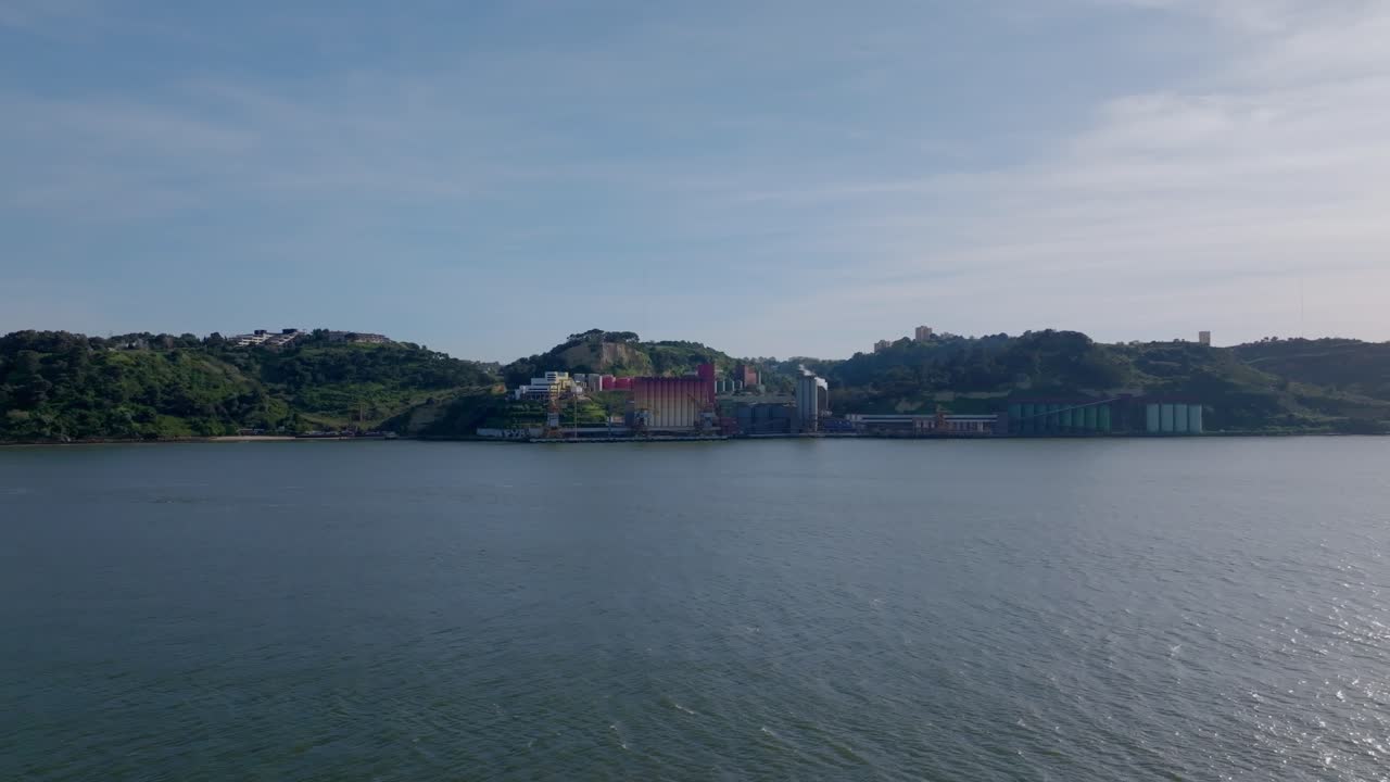 Static drone shot of a factory on the other side of River Tejo in Lisbon. Portugal.
