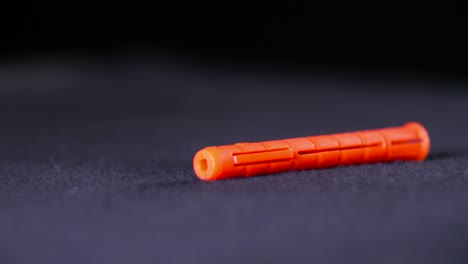 orange plastic wall anchor