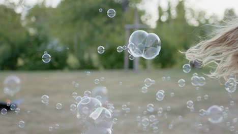 children makes a lot of soap bubbles, which were filmed with a lot of fps